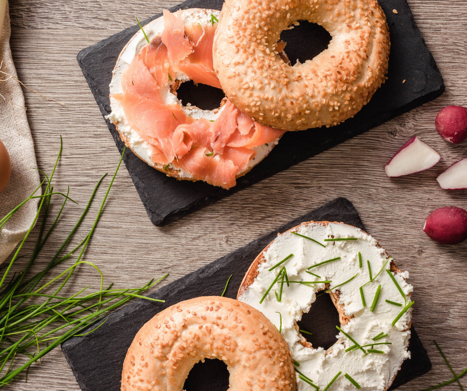 A birds eye shot of an open salmon and cheese bagel